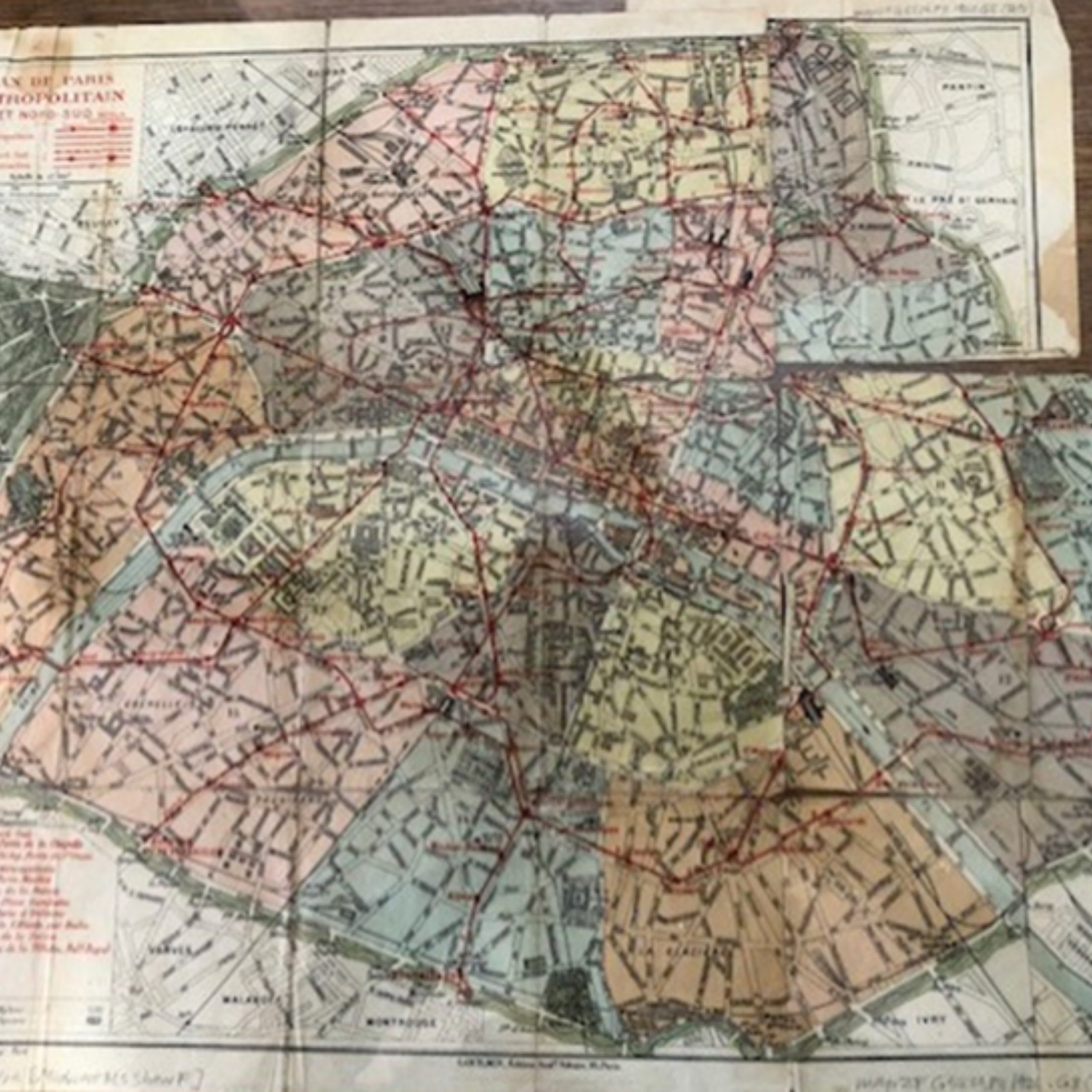 Image of a historic map of Paris, with the arrondissements coordinated and separated by color.