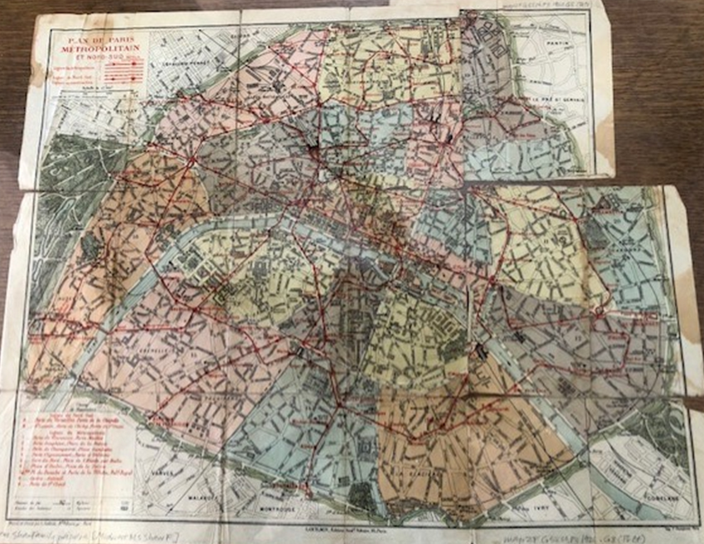 Image of a historic map of Paris, with the arrondissements coordinated and separated by color.